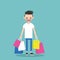 Young trendy bearded man holding shopping bags