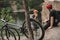 young trial bikers having rest on rocky cliff