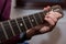 Young unidentifiable musician playing on the guitar