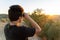 Young Unrecognized Boy Using Binoculars