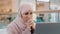 Young upset arab woman receiving email reads bad news on laptop letter with refusal health problems Bank notice for loan