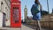 Young Urban Professional Woman By Telephone booth and Big Ben In London