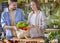 Young vegetarian couple in love preparing dinner with vegetables