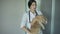 Young veterinarian woman with stethoscope holding cat in vet medical office