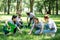 young volunteers cleaning green