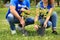 Young volunteers planting tree in green , closeup. Charity work