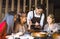 Young waiter  taking an order  in hot pot reataurant