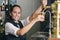 Young waitress serving draft beer