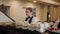 Young waitresses stacking tea cups on bar counter