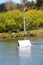 Young wakeboarder going big off a jump at the cable park