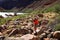 Young waoman backpacker by Hance Rapids in the Grand Canyon.