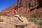 Young waoman backpacker by Hance Rapids in the Grand Canyon.