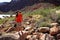 Young waoman backpacker by Hance Rapids in the Grand Canyon.