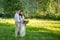 young wedding couple - freshly wed groom and bride posing outdoors on their wedding day color toned image