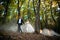 Young wedding couple goes on a picturesque forest