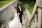 Young wedding couple next to castle