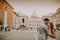 Young wedding couple by Saint Peter cathedral in Vatican