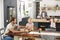 Young white family busy in their kitchen, elevated view