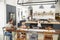 Young white family busy in their kitchen, elevated view