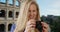 Young white female in Rome takes photos to show friends back home