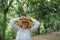 The young white girl on whose hat cattle egret is standing is the most numerous bird of the heron family.