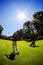 Young white male golfer red shirt