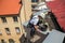 Young Window Cleaner Descend from the Roof of the Building