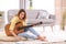 Young woman with acoustic guitar composing song