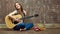 Young woman acoustic guitar play.