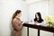 Young woman administrator in a dental clinic in the workplace. Admission of the client