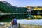 Young woman admires beautiful panorama of Black Lake ( Crno jezero),Durmitor, Montenegro
