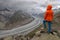 Young woman admiring the Aletsch glacier in the Swiss Alps, Europe