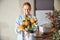 Young woman admiring a beautiful floral arrangement