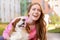 Young woman with adorable Cavalier King Charles Spaniel dog