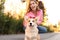 Young woman with adorable Pembroke Welsh Corgi dog