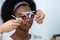 Young woman african american wear trial frame eye test ophthalmological in optics clinic. woman checkup eye health with equipment