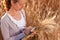 Young woman agronomist in the wheat field