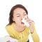 Young woman with a an allergy sneezing into tissues
