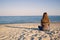 A young woman alone at the seaside