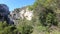 Young woman alone strolling on a path in the canyon of galamus, France