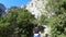 Young woman alone strolling on a path in the canyon of galamus, France