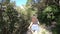 Young woman alone strolling on a path in the canyon of galamus, France