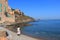 Young woman alone walking on a Mediterranean beach, France