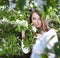 Young woman in the apple garden