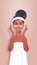 Young woman applying eye patches dressed in towel african american girl cleaning and care her face skincare spa facial