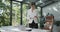 A young woman architect working with invoices at her work office