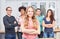 Young woman as apprentice in front of her business team