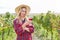 Young woman as a winemaker drinks a glass of red wine