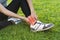 Young woman asian have accident ankle twist sprain in sport exercise jogging, selective focus