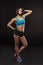Young woman athlet muscle body portrait in gym